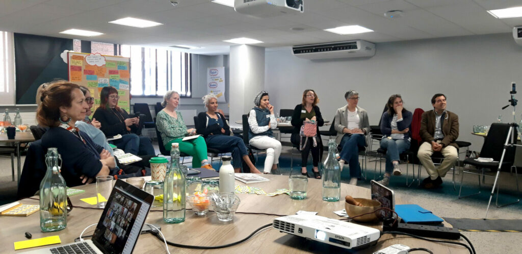 participants listening to a speaker at a confrence