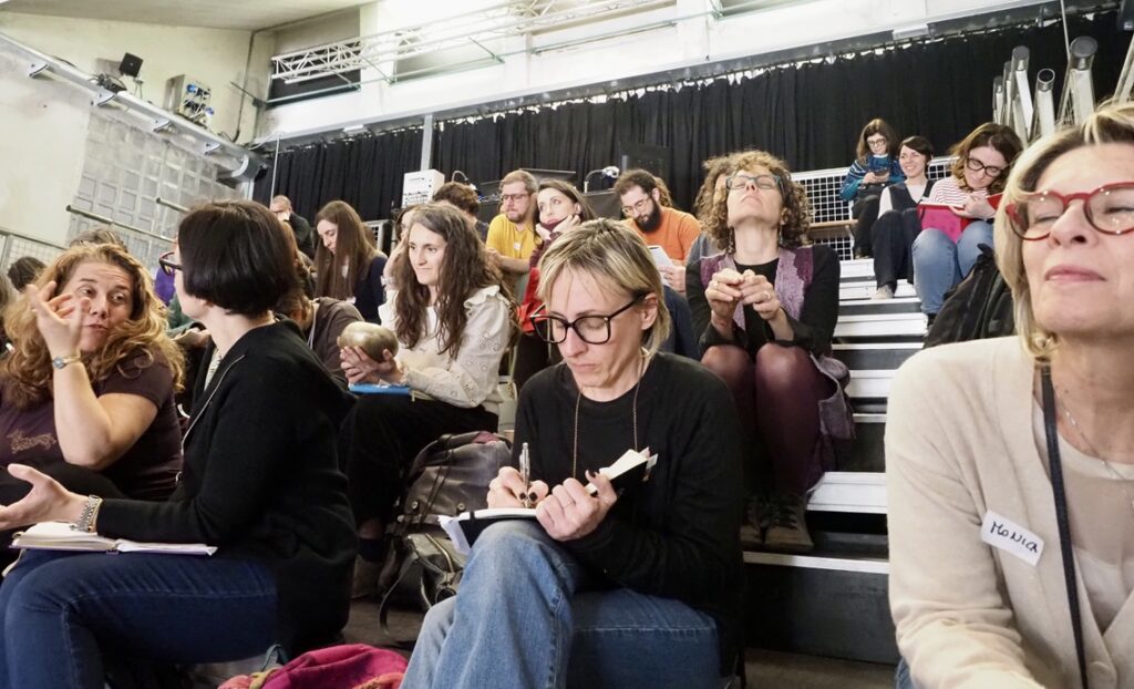 A group of people reflecting and taking notes