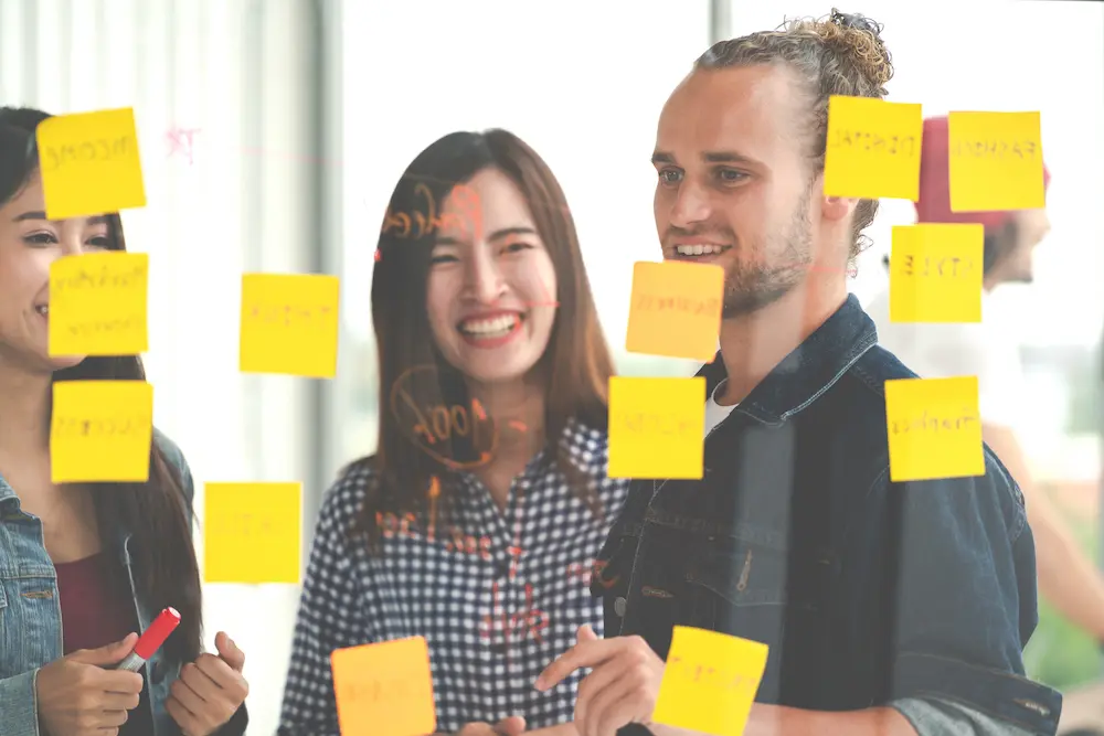 A person brainstorming ideas on a notebook