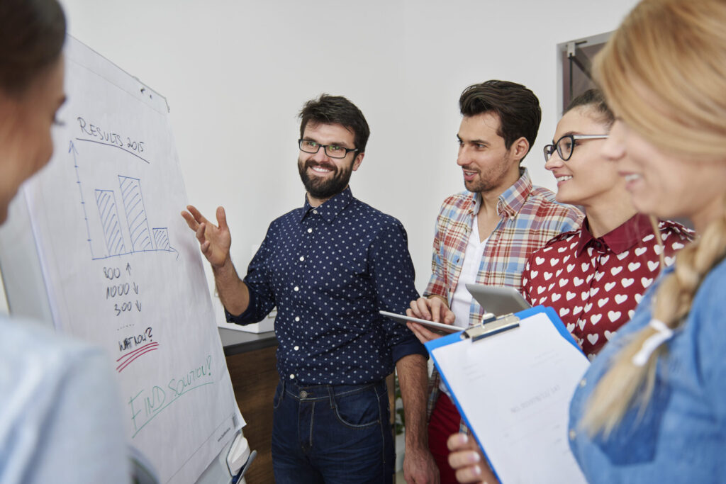 a group of colleagues presenting a report