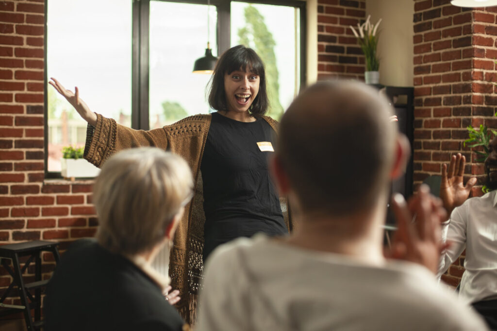 A very cheerful person in front of a room