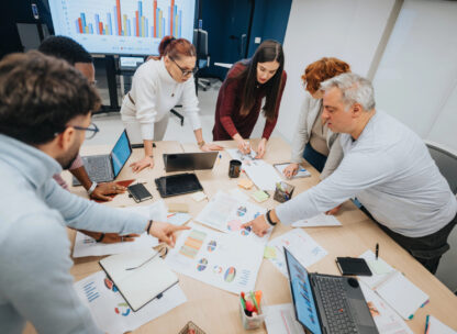 people around a workshop table